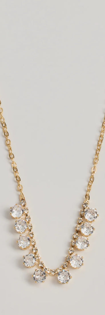 The Delicate Glam Rhinestone And Clear Stone Necklace in gold is a women's workwear piece offering a trendy style and unique accents, perfect for effortlessly creating an outfit-of-the-day look that transitions your office look to going-out ready.