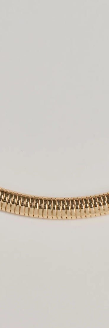 The So Sleek Snake Chain Collar Necklace in gold is a women's workwear piece offering a trendy style and unique accents, perfect for effortlessly creating an outfit-of-the-day look that transitions your office look to going-out ready.