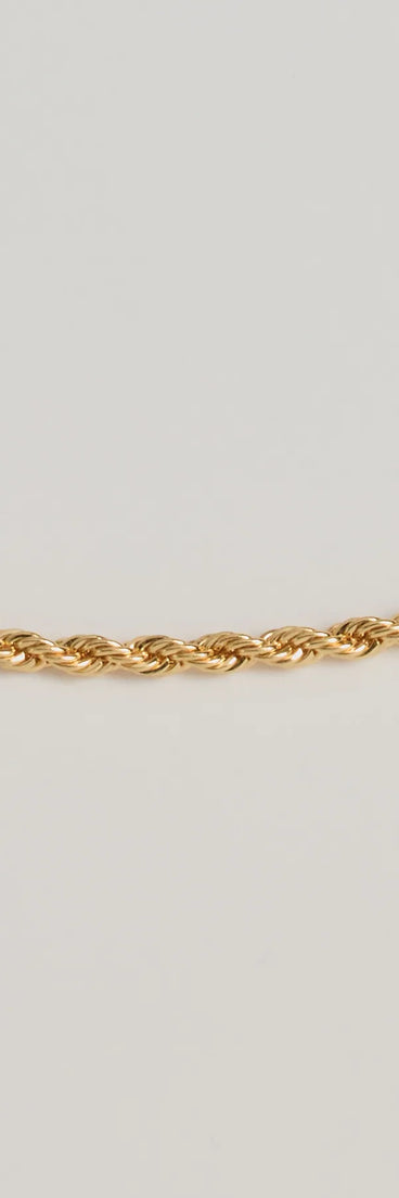 The Bold Twist Metal Chain Necklace in gold is a women's workwear piece offering a trendy style and unique accents, perfect for effortlessly creating an outfit-of-the-day look that transitions your office look to going-out ready.