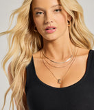 E Initial Layered Bubble Necklace, a trendy gold addition to women's going-out outfits, is ideal for Christmas party outfits, chic NYE attire, or winter night-out looks that keep you on-trend!