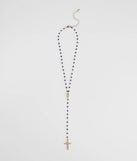 The Beaded Beauty Rhinestone Cross Necklace in black brings edge and energy to your vibe, ready to elevate any festival look or concert outfit.