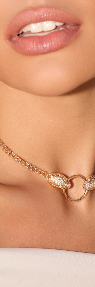 The Snake Charmer Chain Necklace in gold brings edge and energy to your vibe, ready to elevate any festival look or concert outfit.