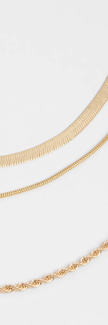 The Keep It Edgy Three-Pack Necklace Set in gold brings edge and energy to your vibe, ready to elevate any festival look or concert outfit.