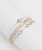 Stay on-trend this season with the Sparkling Addition Heart Charm Layered Bracelet in gold, a must-have for creating stylish and effortless spring outfits for women.