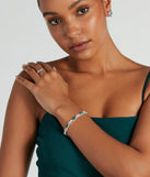 The Glistening Glamour Gemstone And Rhinestone Bracelet helps create a chic emerald green women's cocktail outfit with a trendy texture and stylish design, ideal for wedding guest cocktail outfits or dinner parties.