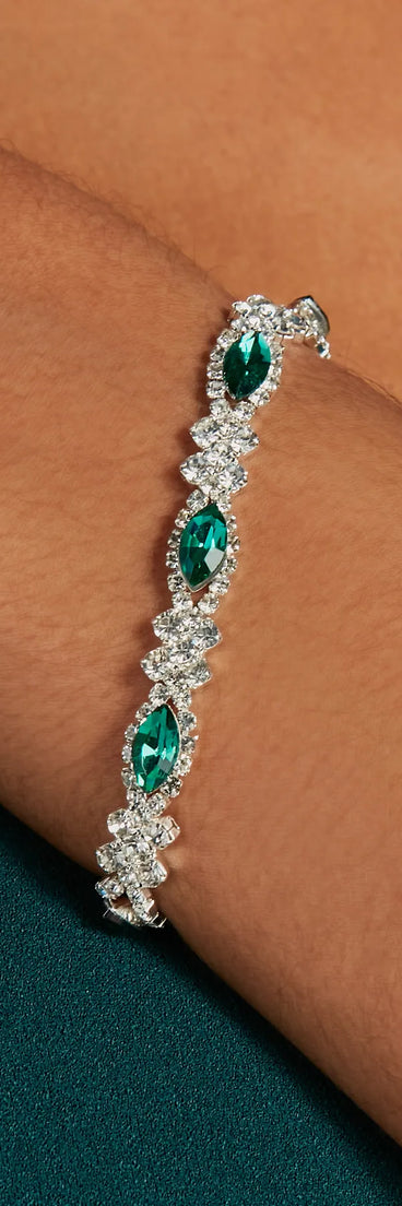 The Glistening Glamour Gemstone And Rhinestone Bracelet helps create a chic emerald green women's cocktail outfit with a trendy texture and stylish design, ideal for wedding guest cocktail outfits or dinner parties.