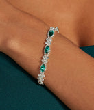 The Glistening Glamour Gemstone And Rhinestone Bracelet helps create a chic emerald green women's cocktail outfit with a trendy texture and stylish design, ideal for wedding guest cocktail outfits or dinner parties.