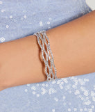 The Dazzling Shine Rhinestone Cuff Bracelet helps create a chic silver women's cocktail outfit with a trendy texture and stylish design, ideal for wedding guest cocktail outfits or dinner parties.