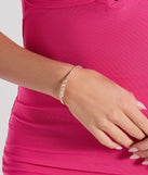 The Dearly Dainty Rhinestone Memory Wire Bracelet helps create a chic clear women's cocktail outfit with a trendy texture and stylish design, ideal for wedding guest cocktail outfits or dinner parties.