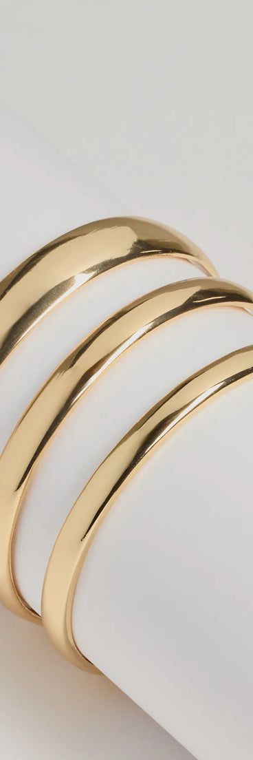 Three Pack Metal Bangle Bracelet Set, a trendy gold addition to women's going-out outfits, is ideal for Christmas party outfits, chic NYE attire, or winter night-out looks that keep you on-trend!