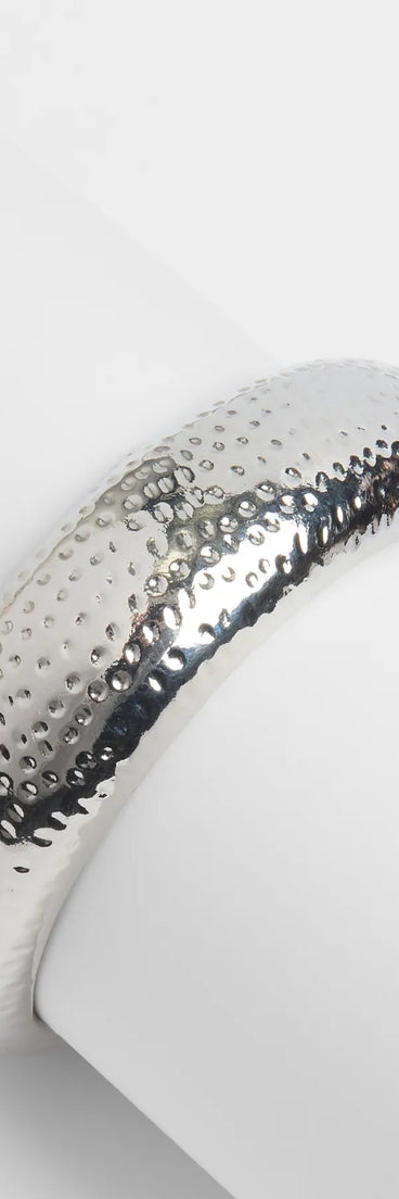 The Confident Aura Statement Bangle Bracelet in silver brings edge and energy to your vibe, ready to elevate any festival look or concert outfit.