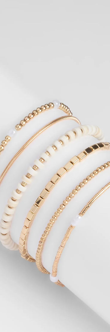 Stay on-trend this season with the Trendy Deets Beaded Bracelet Set in gold, a must-have for creating stylish and effortless spring outfits for women.