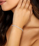 Get ready for any event with the Cubic Zirconia Tennis Bracelet in silver, an essential start to creating a versatile holiday outfit for women for holiday parties, cocktail hours, or NYE events.