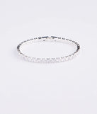 Get ready for any event with the Cubic Zirconia Tennis Bracelet in silver, an essential start to creating a versatile holiday outfit for women for holiday parties, cocktail hours, or NYE events.