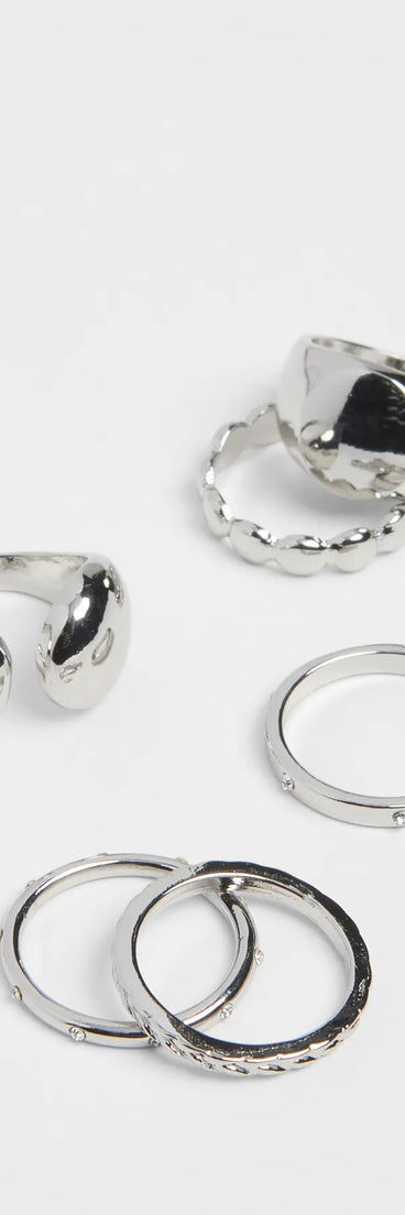 The She's Bold Five Pack Ring Set in silver brings edge and energy to your vibe, ready to elevate any festival look or concert outfit.