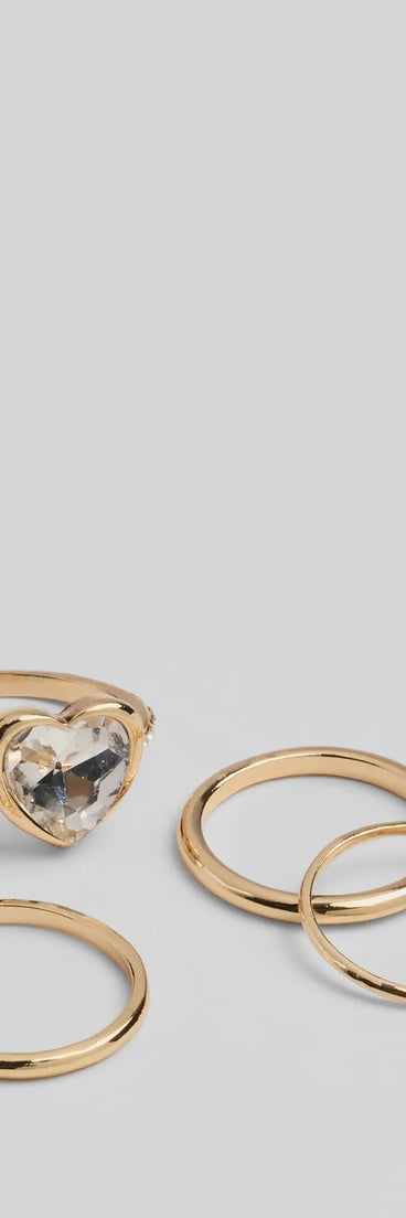 Whether you're dressing up for a romantic date or a Galentine's event, the Stole My Heart Rhinestone Four-Pack Ring Set in gold is the perfect accessory to elevate your Valentine's Day outfit.