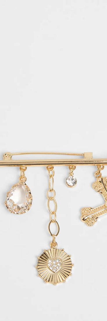 Get inspired with the Glorious Perfection Cross Rhinestone Charm Brooch, a feed-worthy gold piece that’s part of Windsor's updated and curated women’s clothing edit packed with must-have fall outfit ideas.