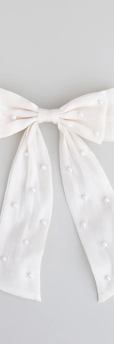 Style your vibe in seconds with the Tied With a Pearl Hair Bow in ivory, a fashion accessories essential that completes any outfit with ease.