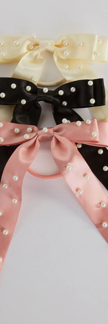 
Upgrade your style game for 2025 with the Posh Faux Pearl Satin Bow Three-Pack Hair Ties, perfect for any fashion-forward wardrobe.