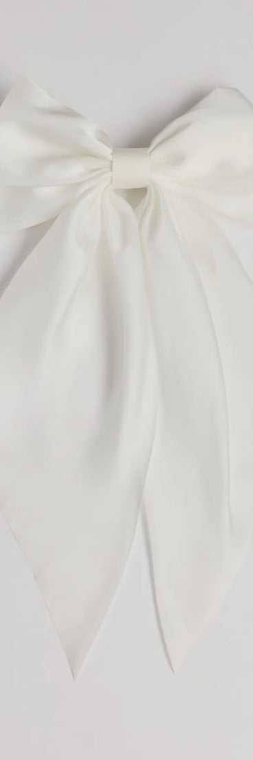 Get ready for any event with the Delicate Glam Large Hair Bow in ivory, an essential start to creating a versatile holiday outfit for women for holiday parties, cocktail hours, or NYE events.
