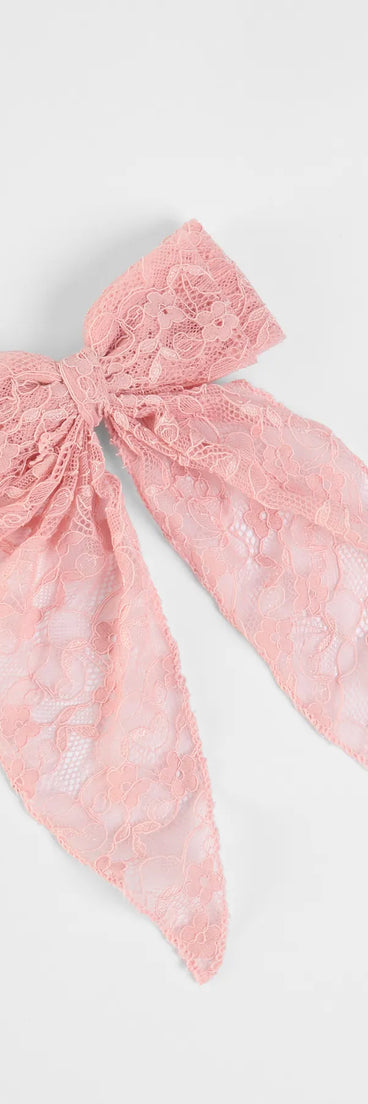 The So Cutesy Long Lace Hair Bow in pink brings sleek style to any graduation outfit, from cap and gown to after-party.