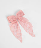 The So Cutesy Long Lace Hair Bow in pink brings sleek style to any graduation outfit, from cap and gown to after-party.