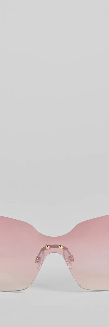 Stole Your Heart Charms Shield Sunglasses, a trendy pink addition to women's going-out outfits, is ideal for Christmas party outfits, chic NYE attire, or winter night-out looks that keep you on-trend!