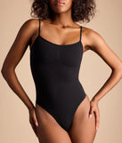 Elevate your winter outfits with the Casually Cute Basic Short Sleeve Bodysuit, a black bodysuit designed for confident and effortless styling with anything from mini skirts to high-waist jeans.