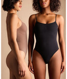 Flaunt your silhouette with the Clean Lines Sleeveless Seamless Knit Bodysuit, a chic black bodysuit crafted for sleek winter looks. Whether you're dressing up for parties or layering for a cozy daytime style, this fitted design adds modern flair to any outfit.