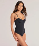 Elevate your winter outfits with the Sculpted Chic Shaper Bodysuit, a black bodysuit designed for confident and effortless styling with anything from mini skirts to high-waist jeans.