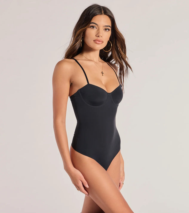 Elevate your winter outfits with the Sculpted Chic Shaper Bodysuit, a black bodysuit designed for confident and effortless styling with anything from mini skirts to high-waist jeans.