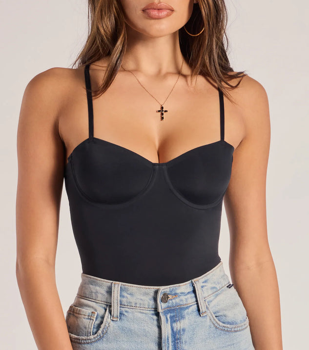 Elevate your winter outfits with the Sculpted Chic Shaper Bodysuit, a black bodysuit designed for confident and effortless styling with anything from mini skirts to high-waist jeans.