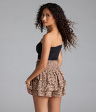 With its midriff cut and trend-forward fit, the Casual Staple Ribbed Knit Bandeau Top is a black crop top made to pair with skirts, denim, or whatever vibe you're feeling this season.