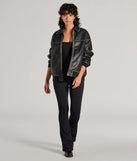 The Stylish Strut Seamless Knit Flared Leg Catsuit in black is a sleek women's catsuit featuring a chic, body-hugging silhouette with on-trend details for a striking profile, perfect for creating going-out looks or party outfits.