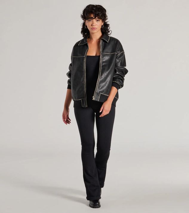 The Stylish Strut Seamless Knit Flared Leg Catsuit in black is a sleek women's catsuit featuring a chic, body-hugging silhouette with on-trend details for a striking profile, perfect for creating going-out looks or party outfits.