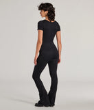 The Stylish Strut Seamless Knit Flared Leg Catsuit is a trendy women's bottom in black, designed with modern details and alluring textures to complete chic outfits for 2025.