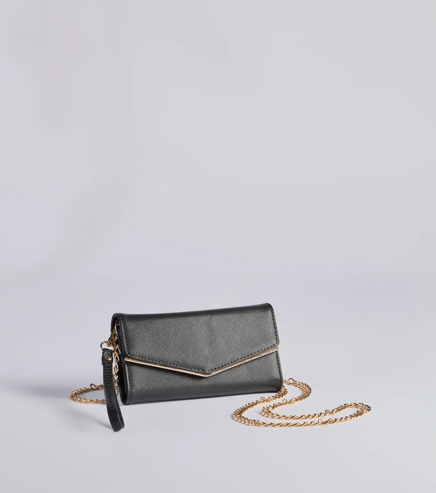 The Classically Chic Faux Leather Envelope Wristlet in black is a women's workwear essential with an elevated fabric and chic silhouette, ideal for layering and versatile enough to take your look from office chic to going-out ready!