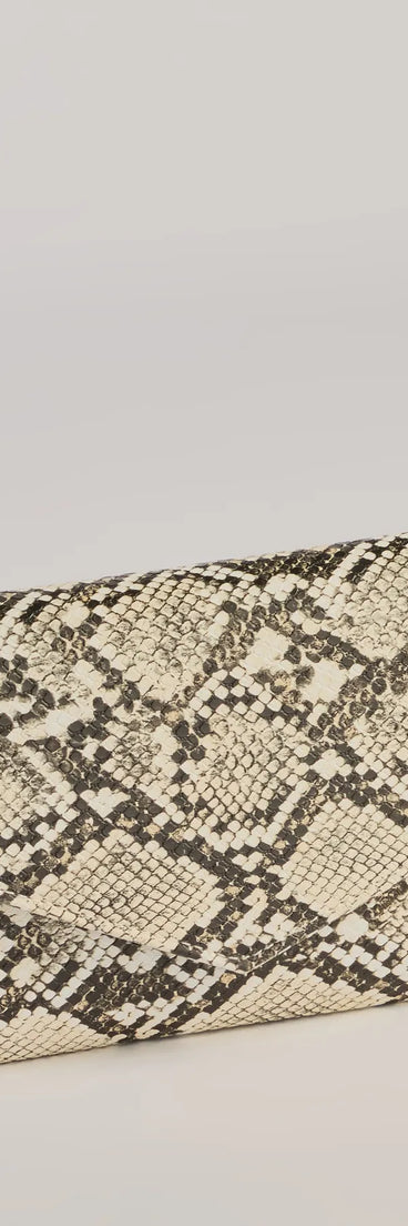 The Wildly Fab Faux Snake Print Wristlet in snake is a women's workwear essential with an elevated fabric and chic silhouette, ideal for layering and versatile enough to take your look from office chic to going-out ready!