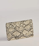 The Wildly Fab Faux Snake Print Wristlet in snake is a women's workwear essential with an elevated fabric and chic silhouette, ideal for layering and versatile enough to take your look from office chic to going-out ready!