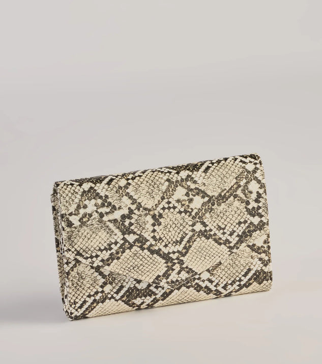 The Wildly Fab Faux Snake Print Wristlet in snake is a women's workwear essential with an elevated fabric and chic silhouette, ideal for layering and versatile enough to take your look from office chic to going-out ready!