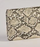 The Wildly Fab Faux Snake Print Wristlet in snake is a women's workwear piece offering a trendy style and unique accents, perfect for effortlessly creating an outfit-of-the-day look that transitions your office look to going-out ready.