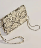 The Wildly Fab Faux Snake Print Wristlet in snake is a women's workwear piece offering a trendy style and unique accents, perfect for effortlessly creating an outfit-of-the-day look that transitions your office look to going-out ready.