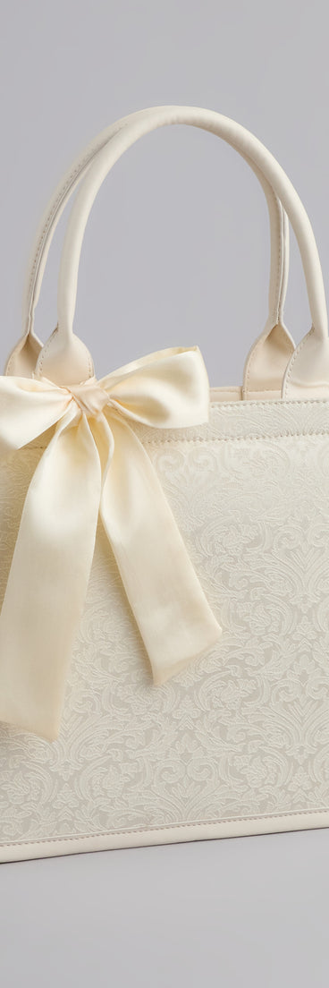 Get inspired with the Scenic Embroidered Satin Bow Tote Bag, a feed-worthy piece that’s part of Windsor's updated and curated women’s clothing edit packed with must-have fall outfit ideas.