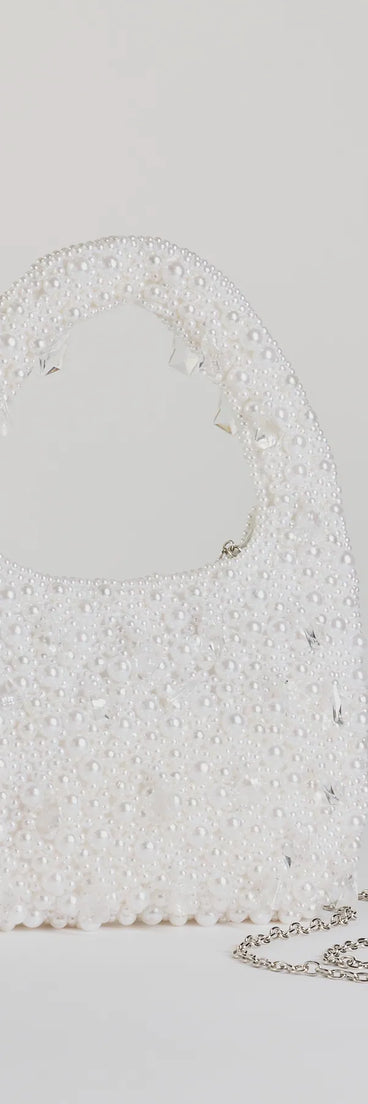 Get ready for any event with the Timeless Chic Beaded Faux Pearl Handbag in pearl, an essential start to creating a versatile holiday outfit for women for holiday parties, cocktail hours, or NYE events.