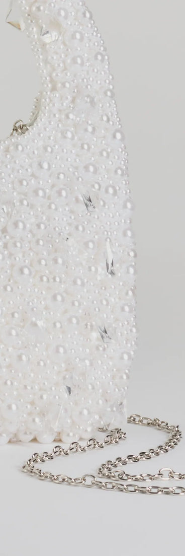 Get ready for any event with the Timeless Chic Beaded Faux Pearl Handbag in pearl, an essential start to creating a versatile holiday outfit for women for holiday parties, cocktail hours, or NYE events.