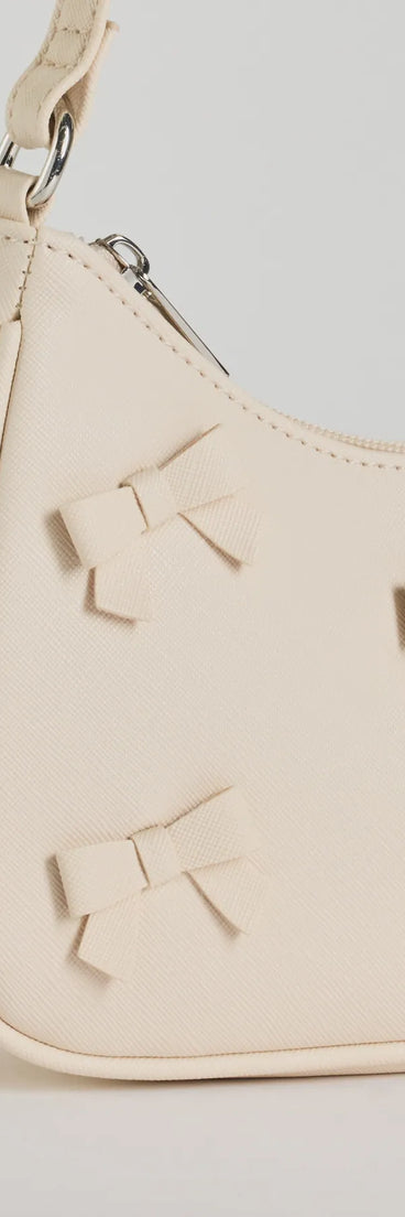 This white piece brings trend-right energy to the Poised Cuteness Bow Saffiano Shoulder Bag, perfect for fall outfits that stand out.