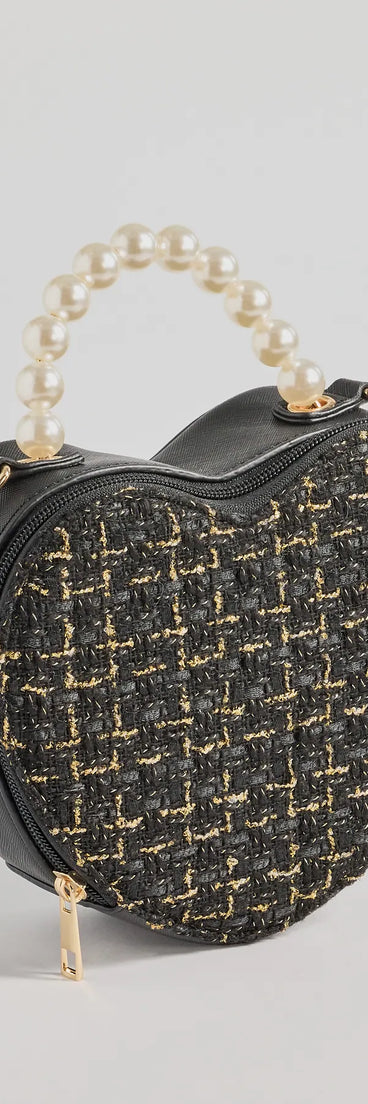 The Fab Icon Houndstooth Tweed Heart Bag in black is an elevated pick for your best outfit yet, effortlessly delivering a polished look that's sure to turn heads at any celebration.