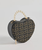 The Fab Icon Houndstooth Tweed Heart Bag in black is an elevated pick for your best outfit yet, effortlessly delivering a polished look that's sure to turn heads at any celebration.