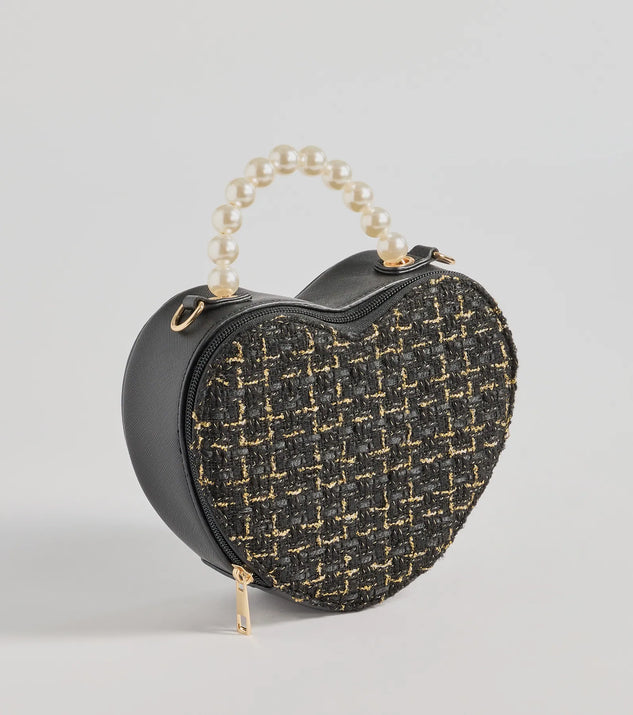 The Fab Icon Houndstooth Tweed Heart Bag in black is an elevated pick for your best outfit yet, effortlessly delivering a polished look that's sure to turn heads at any celebration.