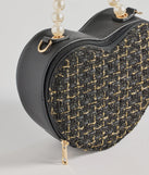 The Fab Icon Houndstooth Tweed Heart Bag in black is an elevated pick for your best outfit yet, effortlessly delivering a polished look that's sure to turn heads at any celebration.